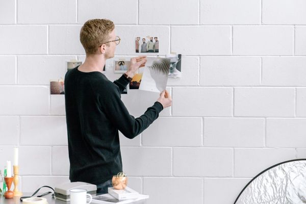 An artist looking at his AI-generated artwork